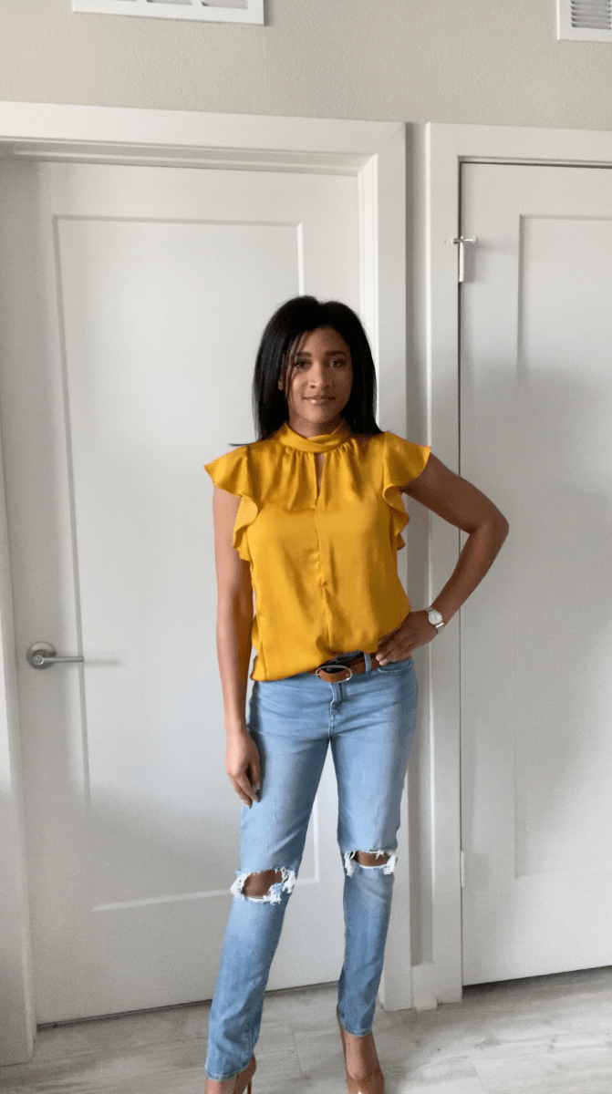 Orange blouse and light blue distressed denim jeans outfit