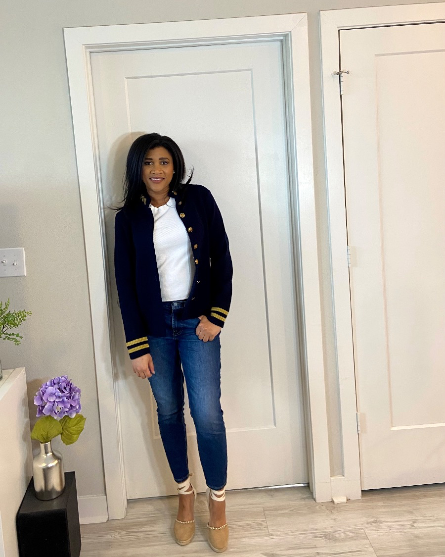 The Emerald Glam wearing navy blue military inspired jacket with ribbed white tee jeans and tan espadrilles